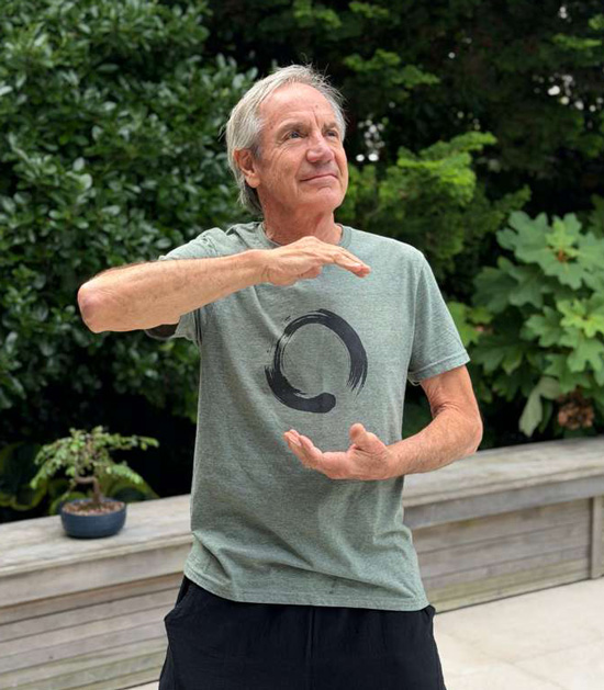 Tenzin Shopal practicing Qigong in a garden